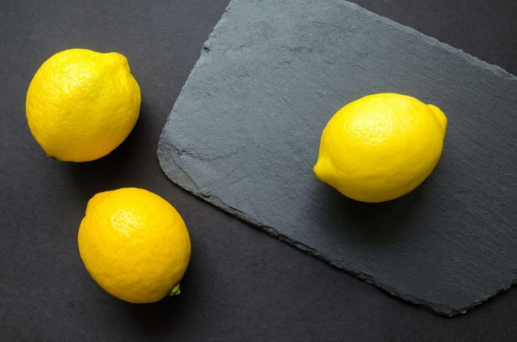 Three lemons on a slate