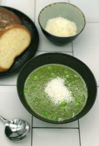Easy peasy Pea and mint soup with parmesan, bread and a spoon