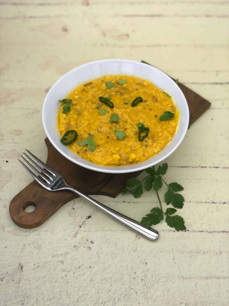 Best tarka dhal on a wooden board with coriander