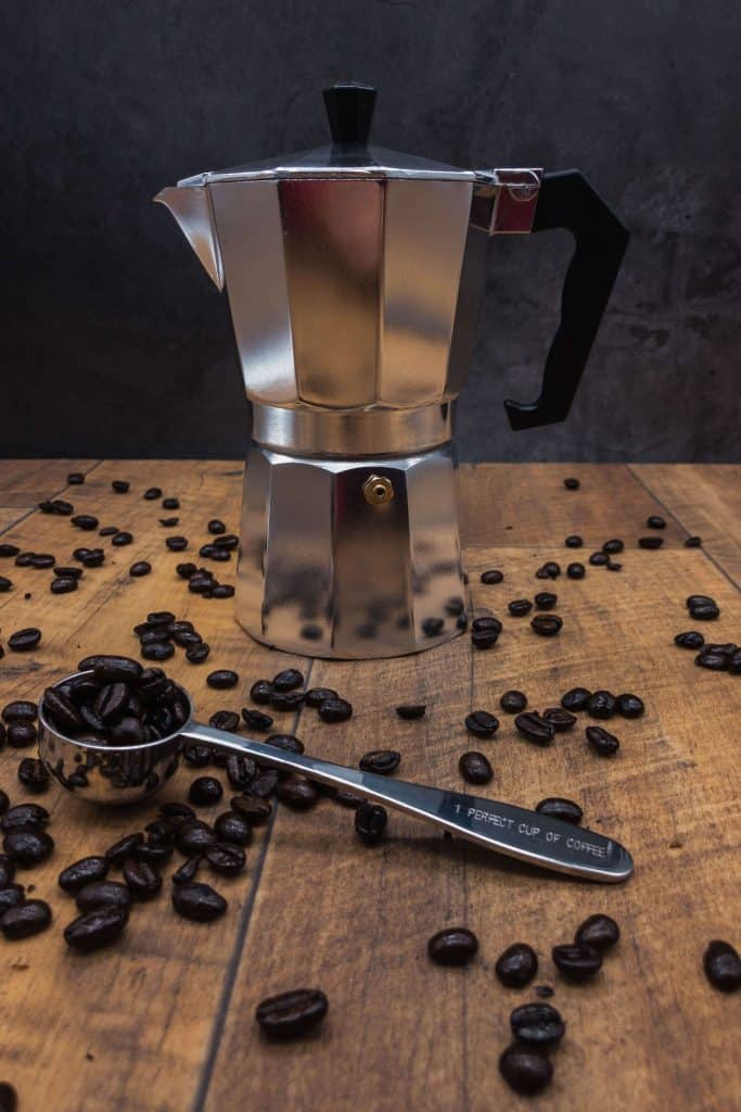 Stove top espresso pot and coffee beans