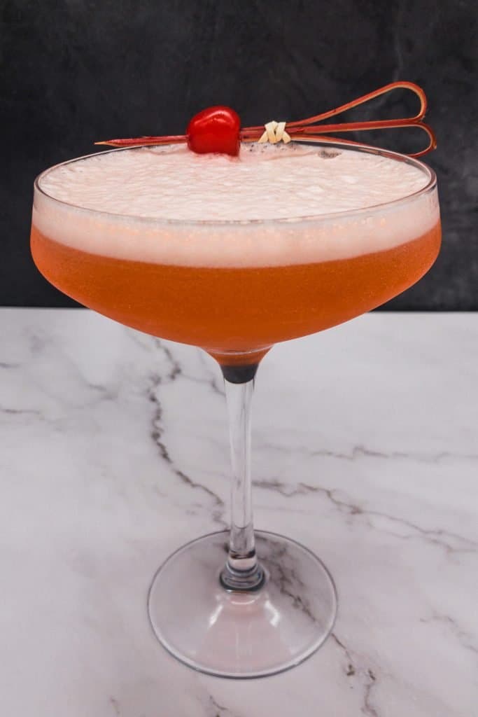 A delicious aperol cocktail with an egg white top