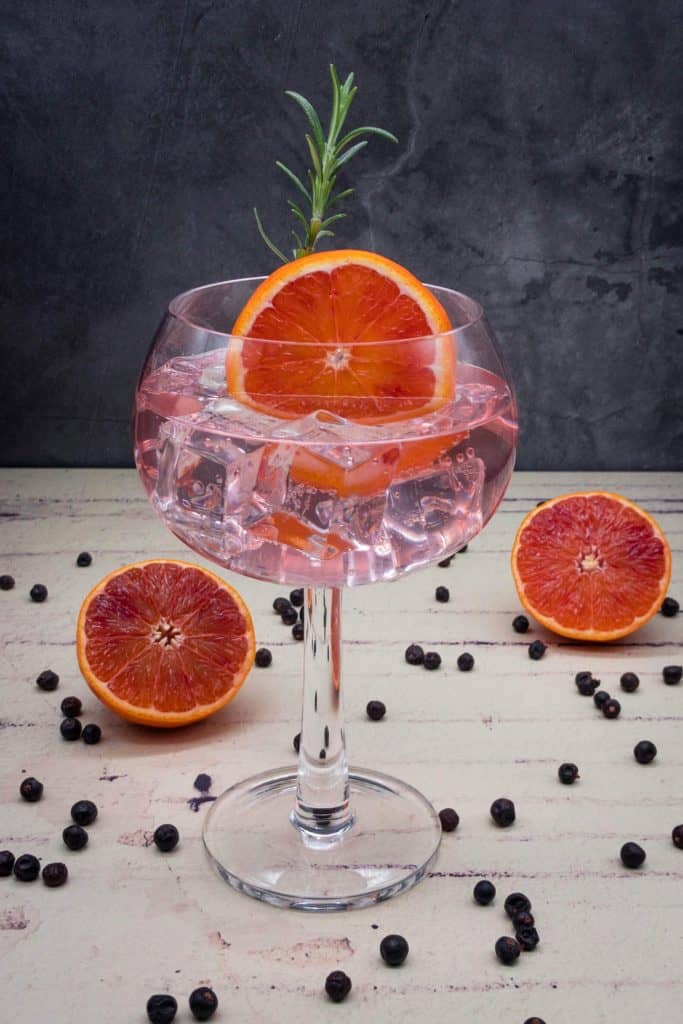 A glass of homemade blood orange gin and tonic