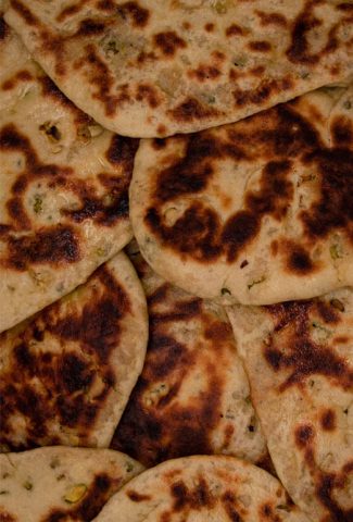 Peshwari naans stuffed with desiccated coconut, sugar and almonds