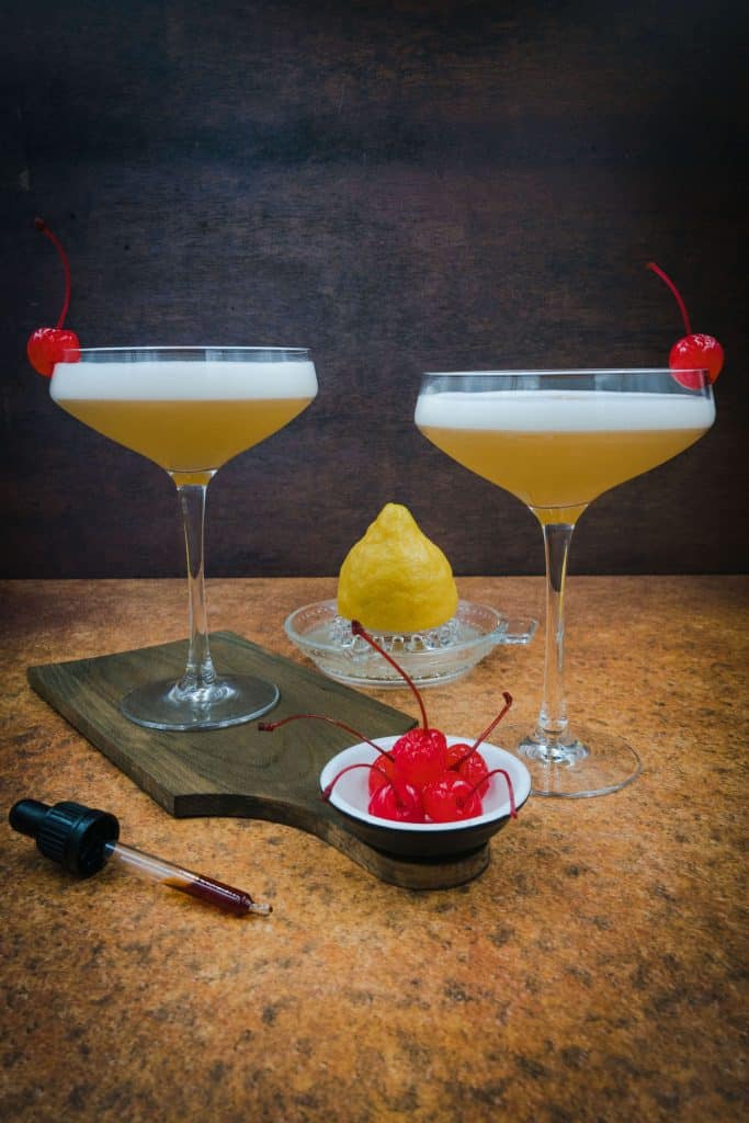 Perfect homemade whiskey sours cocktails with Maraschino cherries