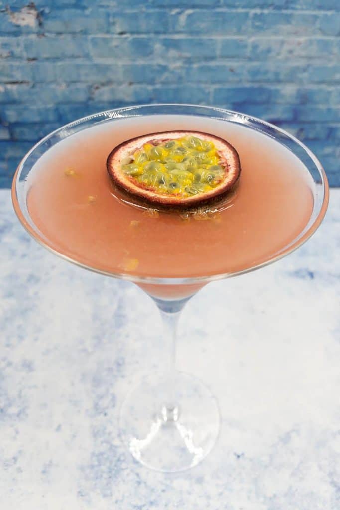 Passion fruit daiquiri with a floating passion fruit as garnish