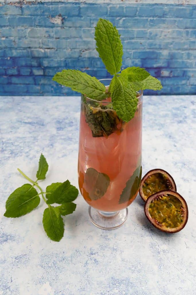 Homemade passion fruit mojito with mint leaves and passion fruit