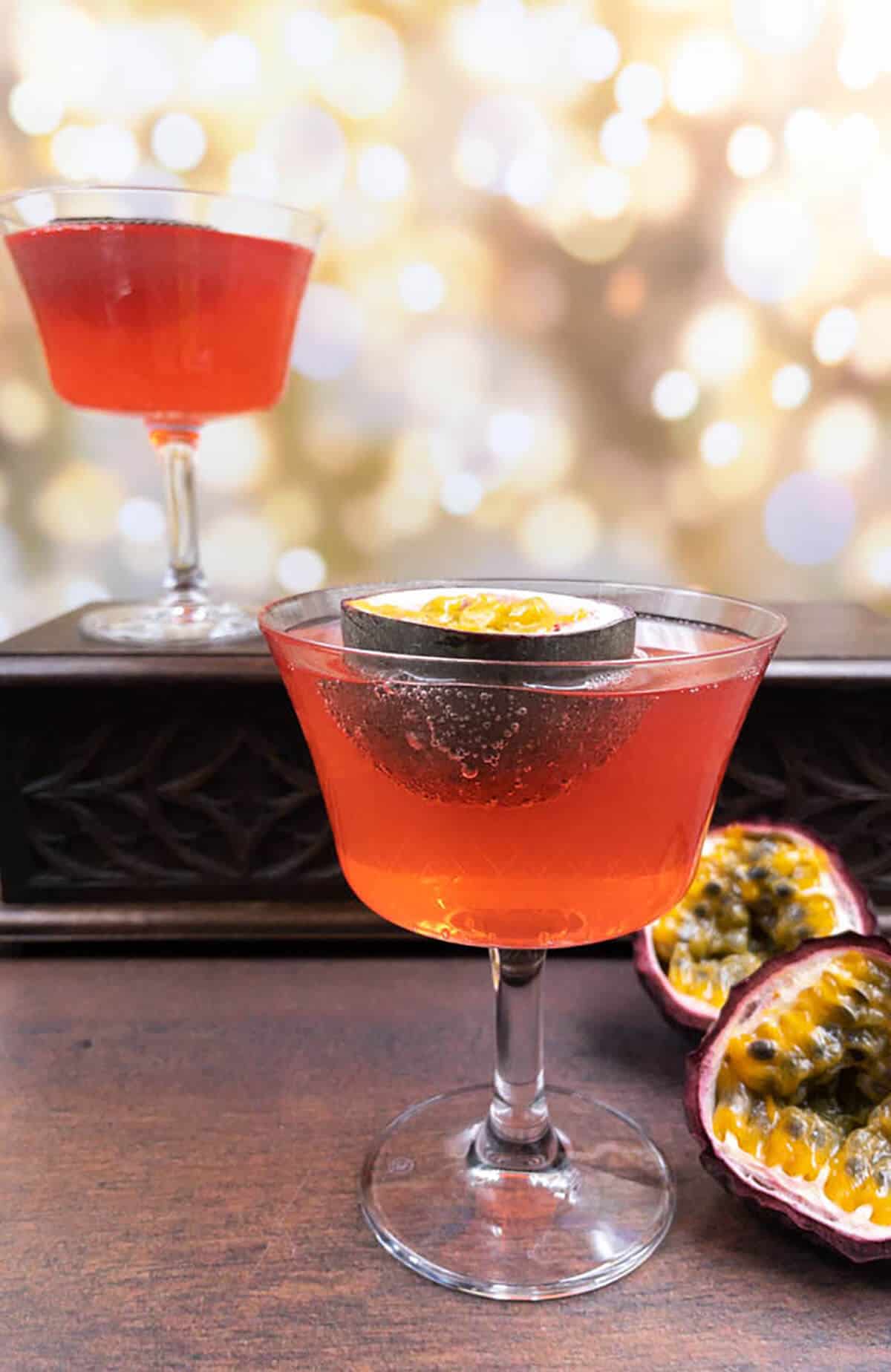 Two servings of passion fruit spritz with one on top of a box