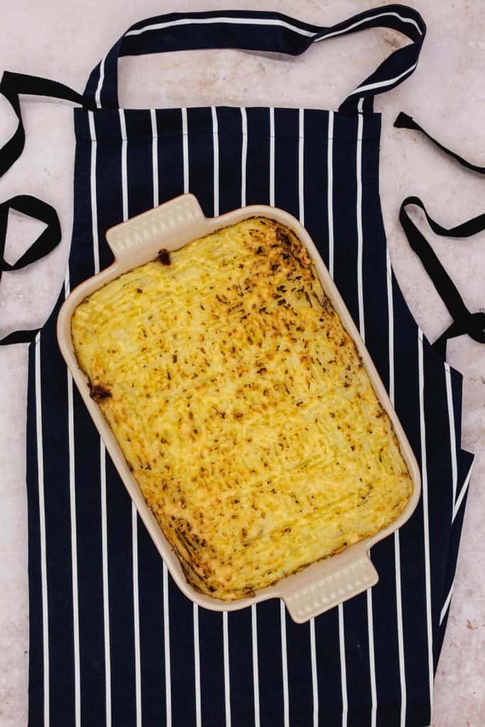 Vegetarian cottage pie on an apron