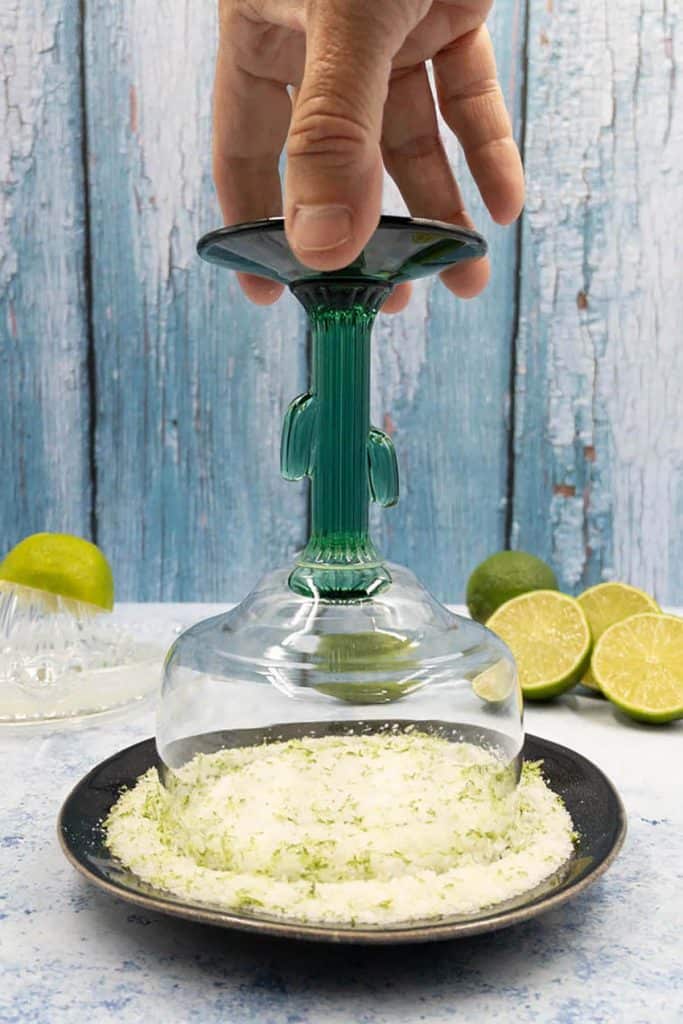Making lime zest salt rim on cactus margarita glass.