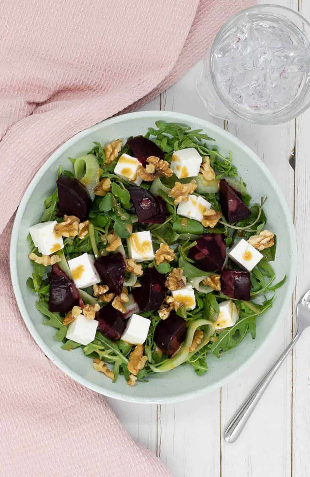 A salad with beets, walnuts and feta cheese.