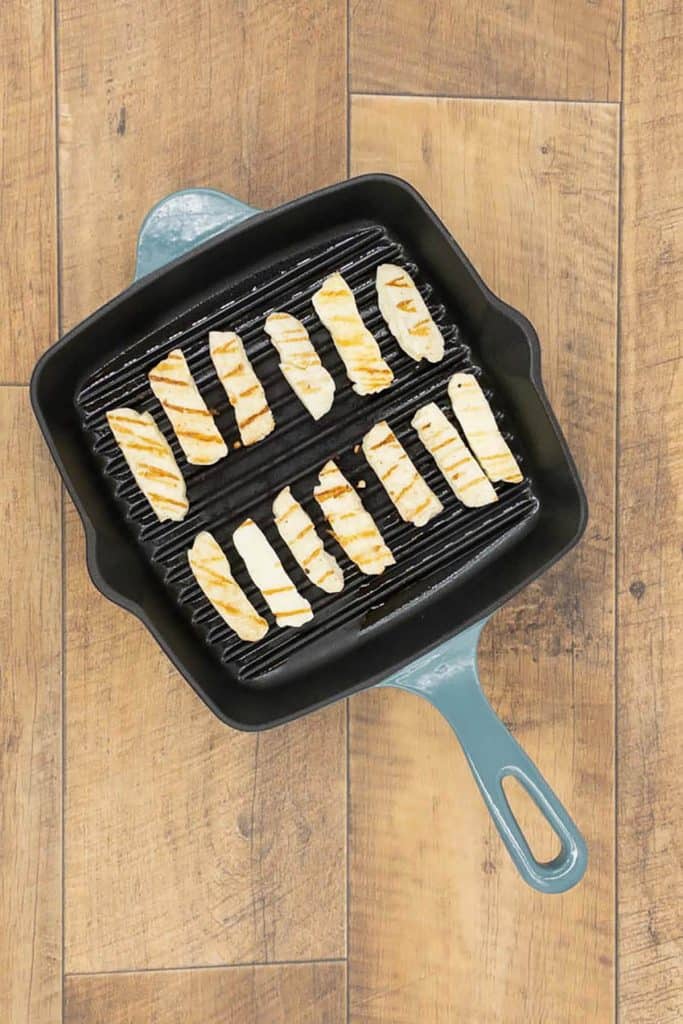 Grilled halloumi in a pan.