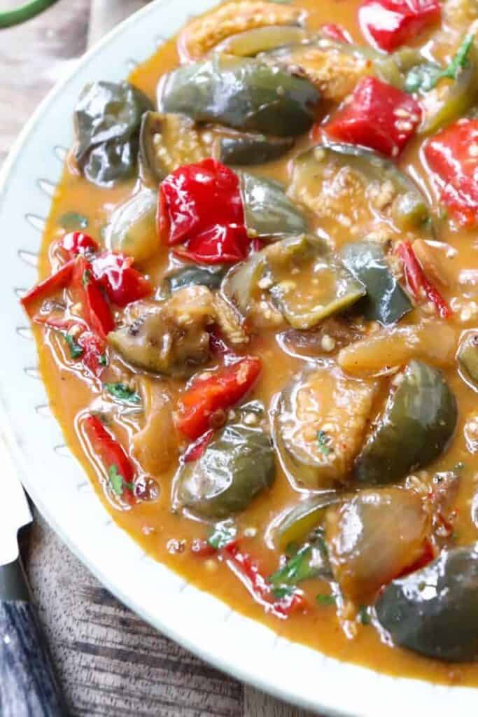 A bowl of Thai eggplant curry in a delicious curry sauce.