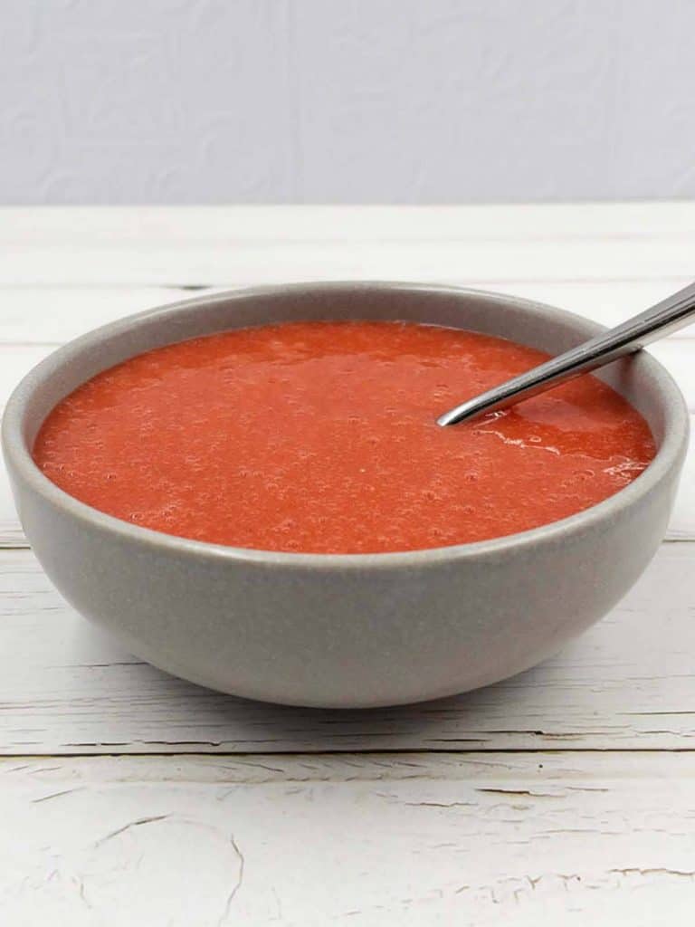 Homemade strawberry puree in a large bowl.