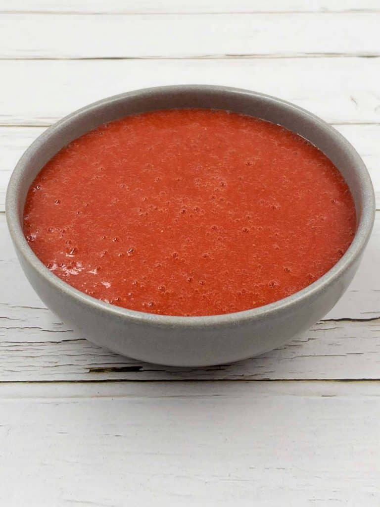 A large bowl of homemade strawberry puree.