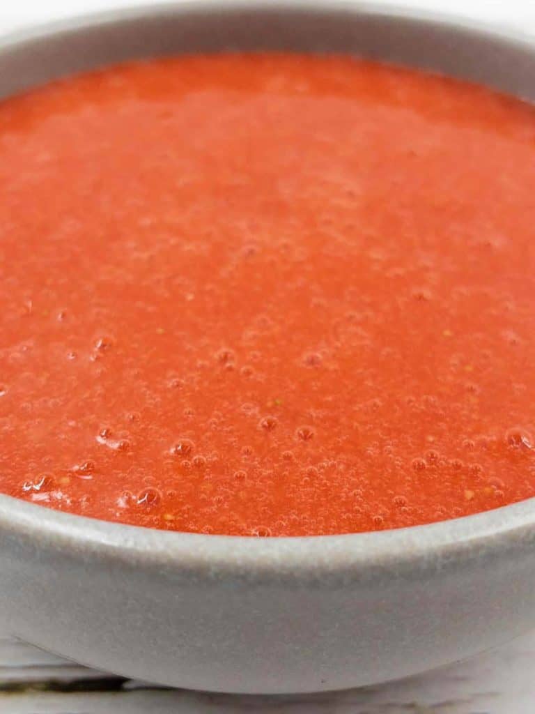 Close up of freshly made strawberry puree.