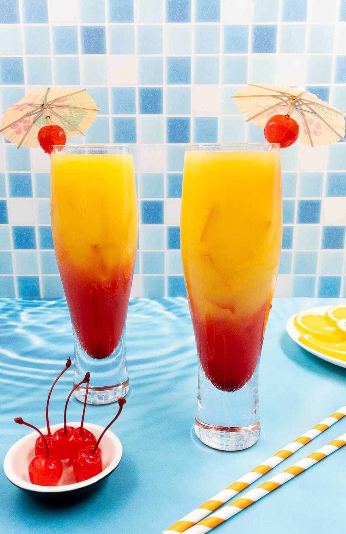 Two tequila sunrise cocktails.