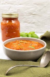 Marinara sauce in a bowl and a mason jar.