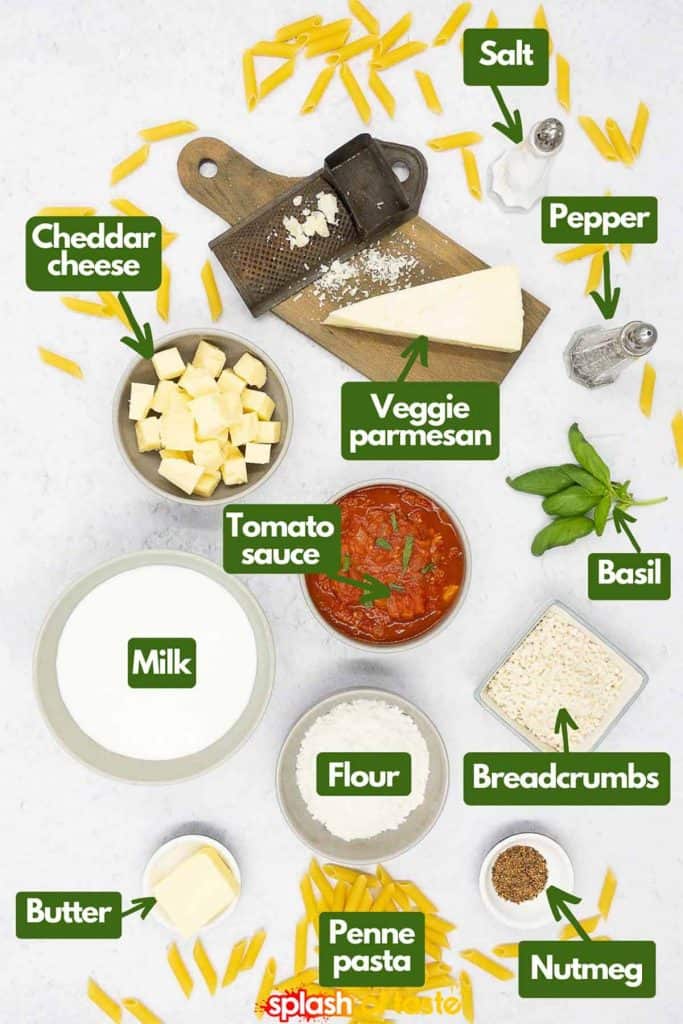 Ingredients for making a homemade vegetarian pasta al forno, salt and pepper, vegetarian parmesan, fresh basil, breadcrumbs, ground nutmeg, penne pasta, flour, butter, milk, tomato sauce and cheddar cheese.
