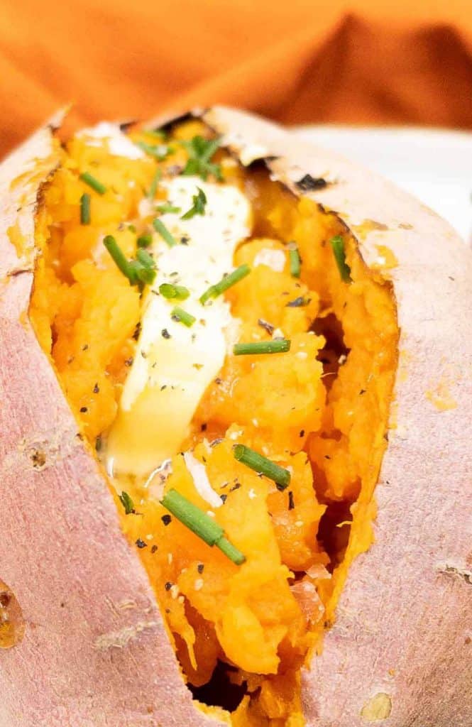 A delicish oven baked sweet potato with butter, sea salt and chives.