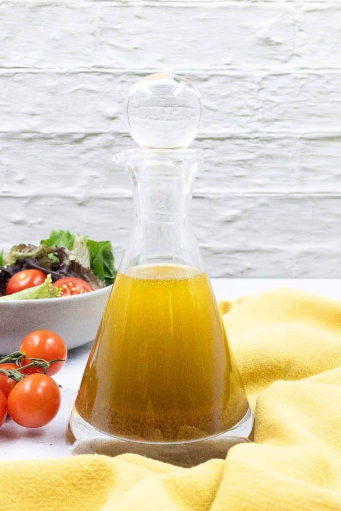 Homemade balsamic vinaigrette dressing in an oil bottle.