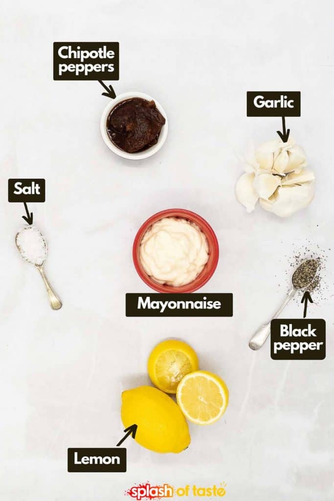 Ingredients needed to make chipotle aioli, chipotle peppers in adobo sauce, garlic, salt and pepper, mayonnaise and fresh lemon.