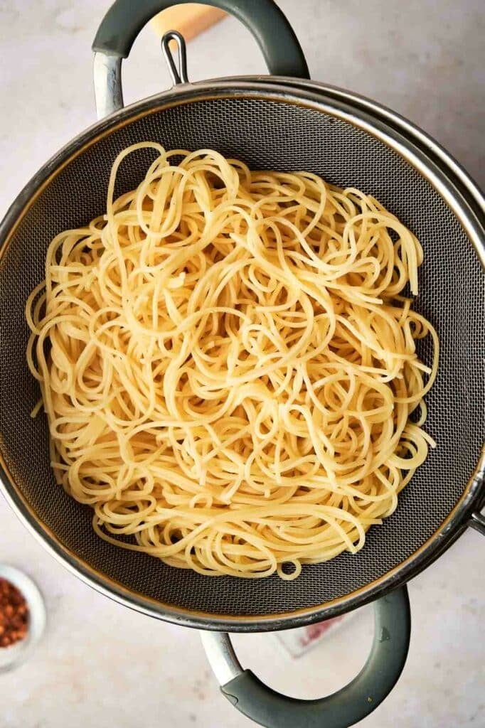Pasta drained in a strainer.