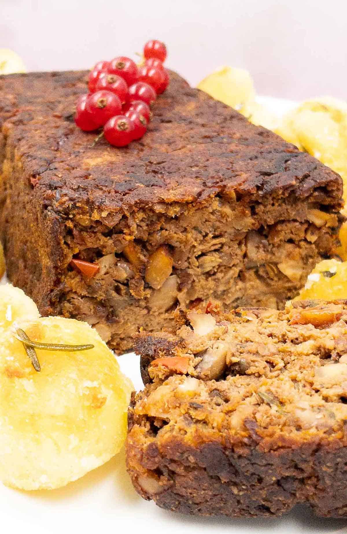Delicious nut roast freshly cooked with roasted potatoes.