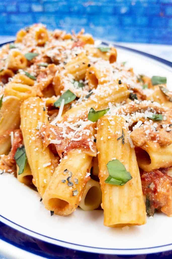 Close up of rigatoni with pink tomato sauce.