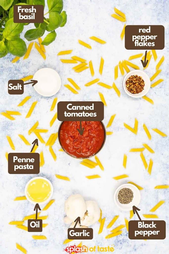 Ingredients for making your own penne arribiata, fresh basil, sea salt, red pepper flakes, black pepper, penne pasta, olive oil, chopped tomatoes and fresh garlic.