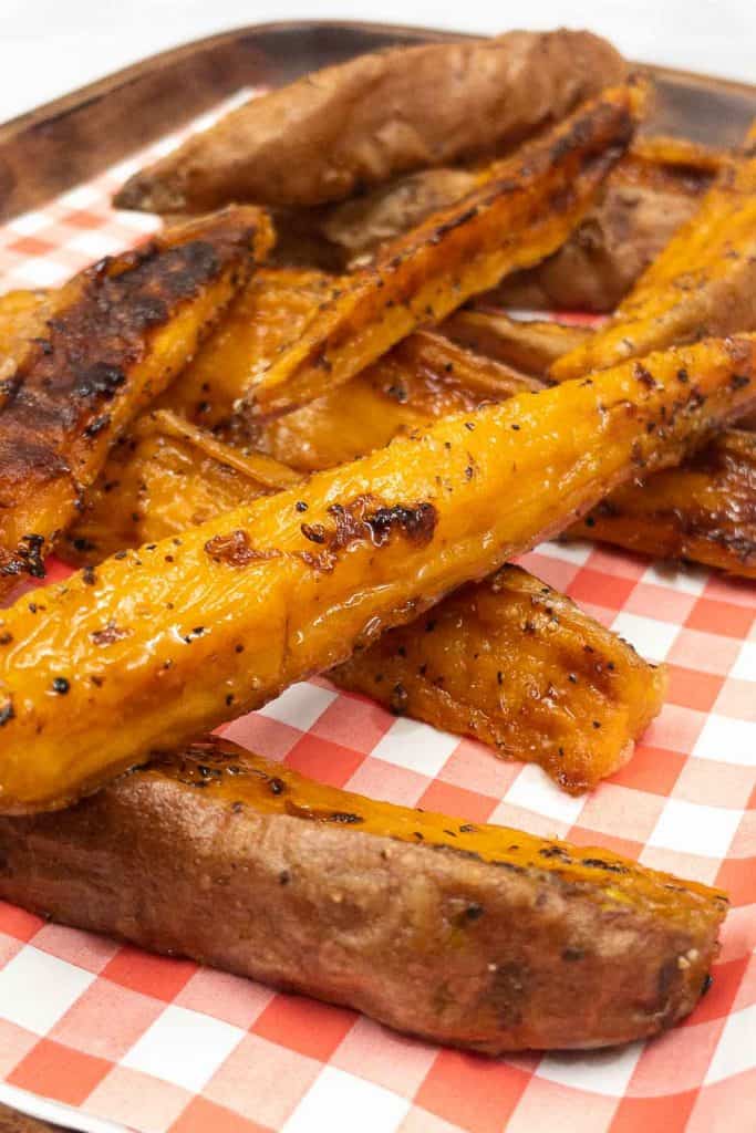 A tray with freshly made roasted sweet potato wedges fresh out of the oven.