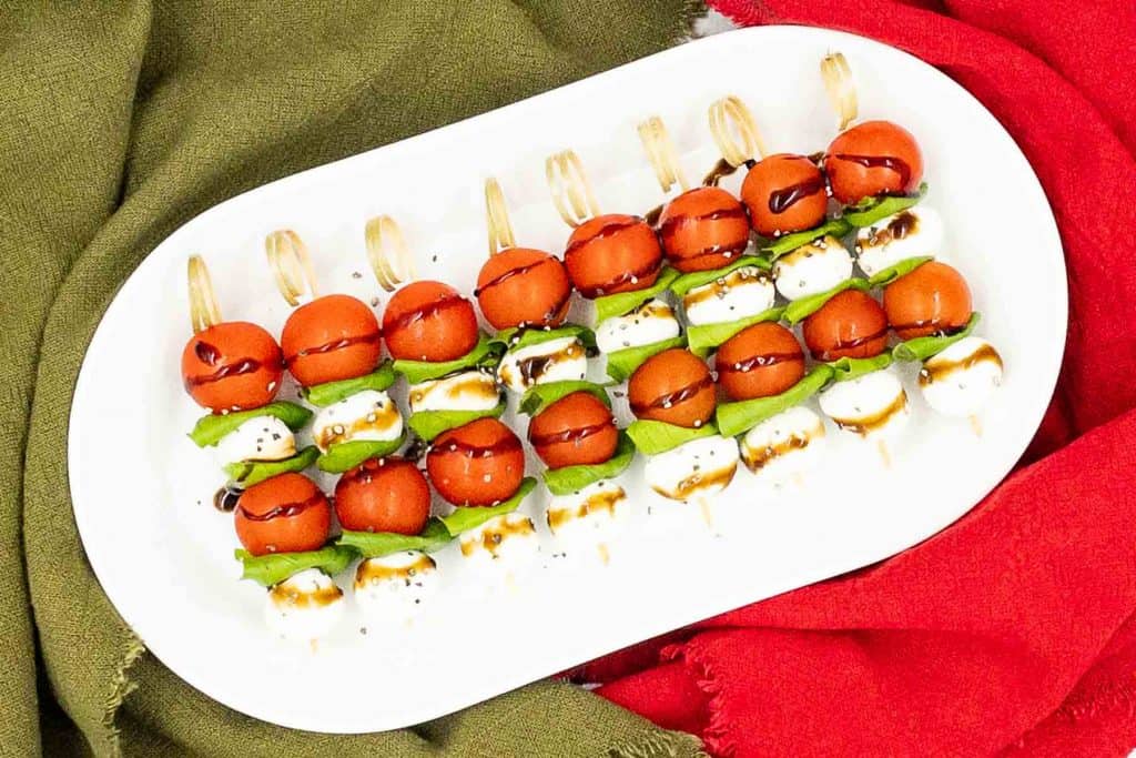 Caprese skewers on a serving tray, homemade and ready to eat.