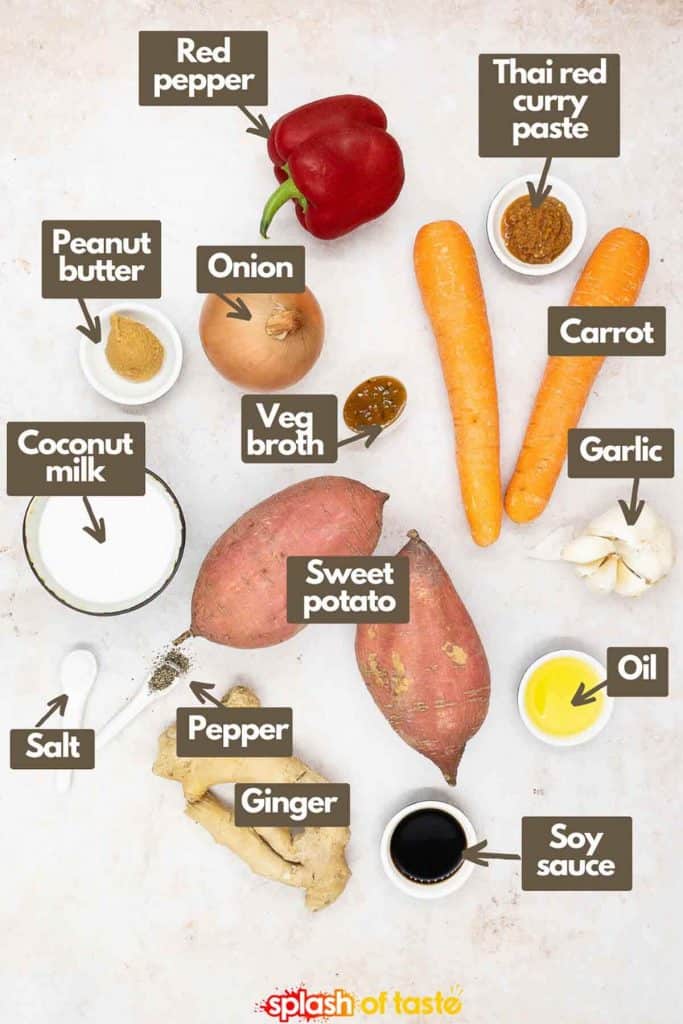 Ingredients for making creamy sweet potato soup, red pepper, Thai red curry paste, carrots, garlic cloves, olive oil, soy sauce, sweet potatoes, vegetable broth, salt and black pepper, full fat coconut milk, peanut butter and onion.