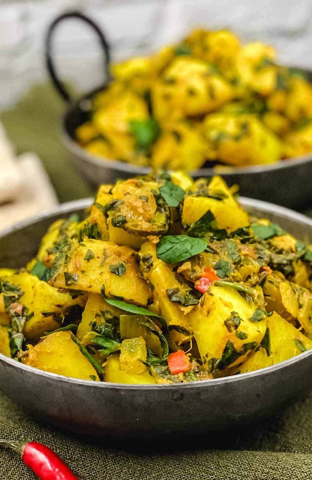 Two delicious bowls of aloo palak.