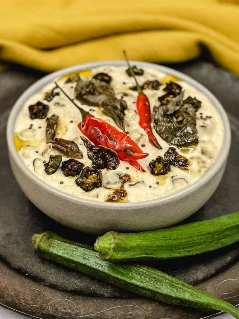 A delicious bowl of homemade okra raita, with tempering and okras.