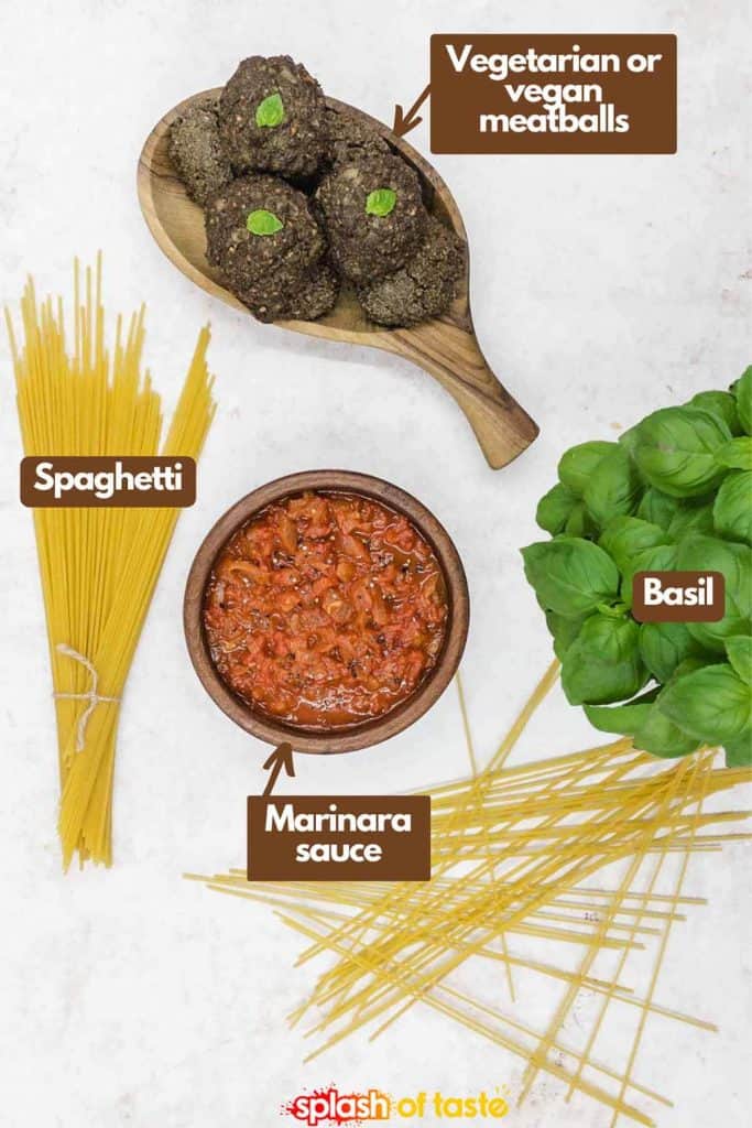 Ingredients needed to make veggie meatballs vegetarian or vegan meatballs, fresh basil, marinara sauce and spaghetti.