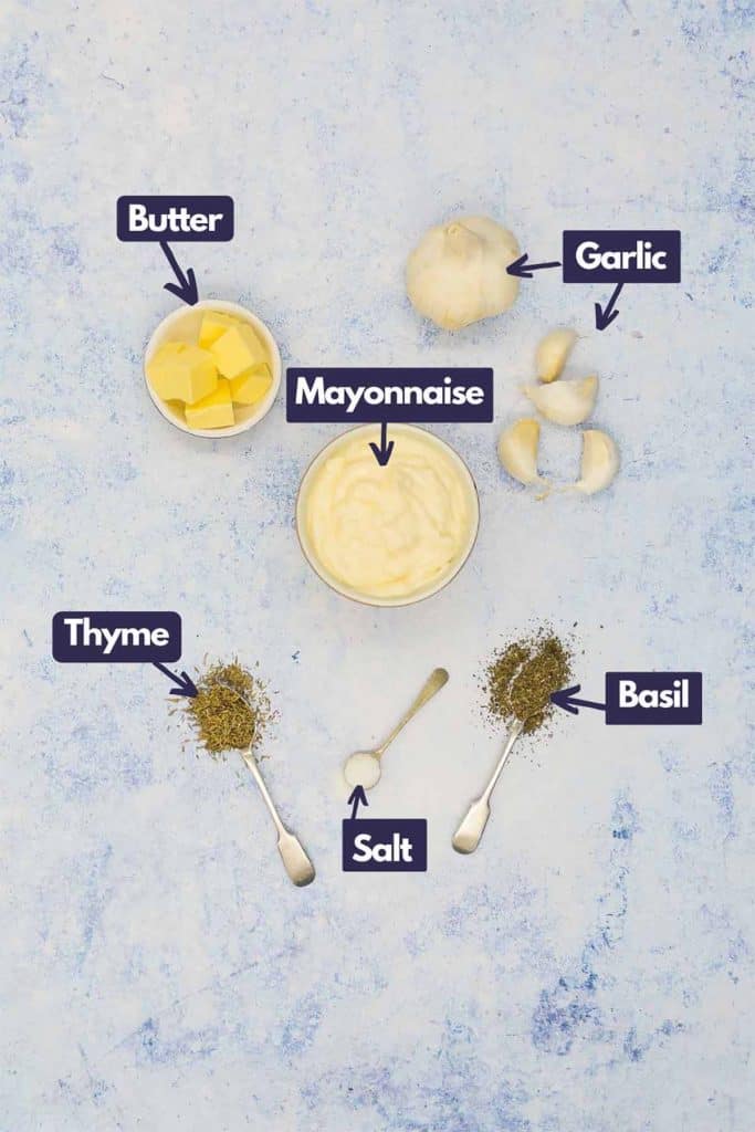 Ingredients needed to make garlic dip, butter, mayonnaise, garlic cloves, dried basil, kosher salt, and dried thyme.
