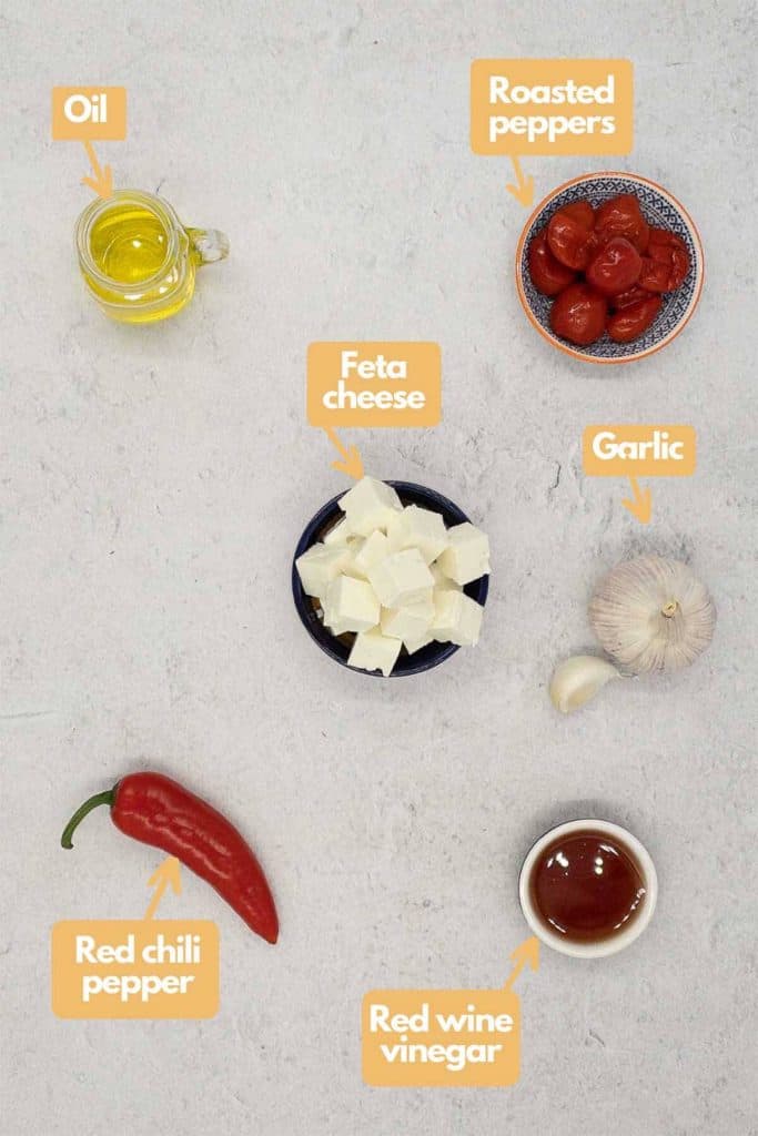 Ingredients needed olive oil, roasted red peppers, feta cheese, garlic, red wine vinegar, and a red chili pepper.