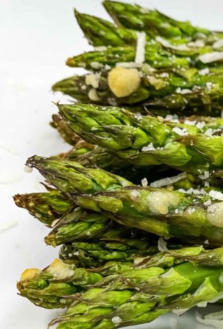 Air fryer asparagus with melted veggie Parmesan cheese.