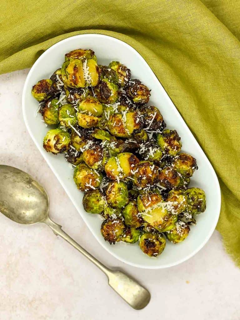 A plate of air fryer Brussels sprouts, out of the air fryer.