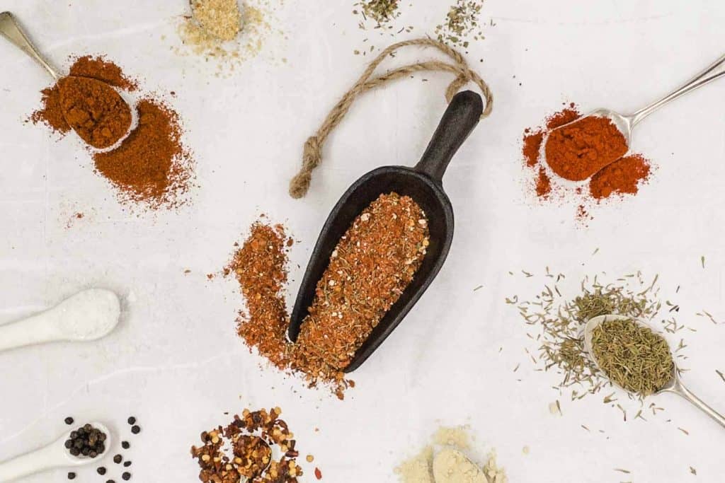 Creole seasoning with all the ingredients around it.