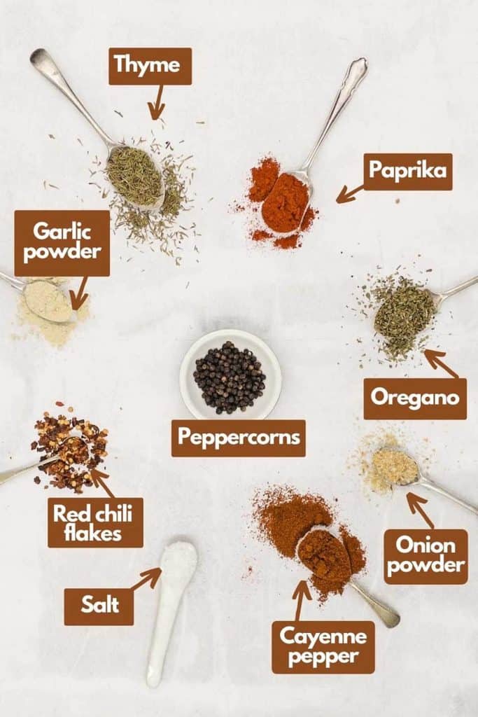 Ingredients needed dried thyme, paprika, dried oregano, onion powder, peppercorns, cayenne pepper, salt, red chili flakes, & garlic powder.