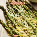 Air fryer asparagus drizzled with lemon and sprinkled with parmesan.