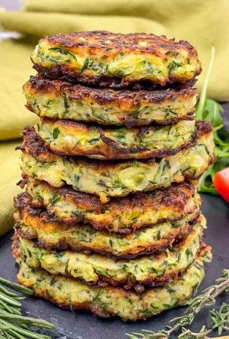 A stack of homemade zucchini fritters freshly made.