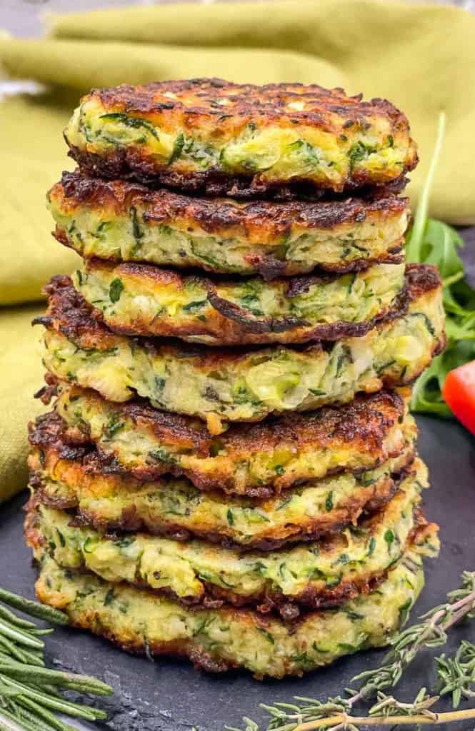 A stack of homemade zucchini fritters freshly made.