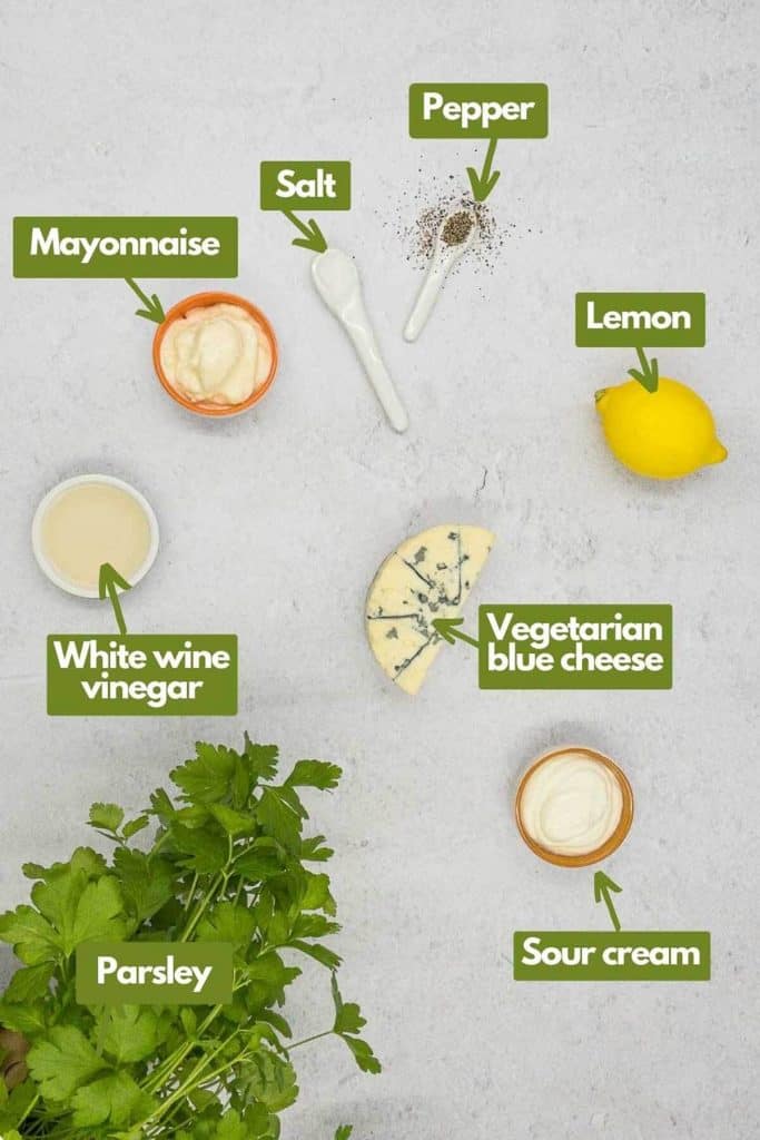 Ingredients needed, mayonnaise, salt, pepper, lemon, vegetarian blue cheese, sour cream, white wine vinegar, and parsley.