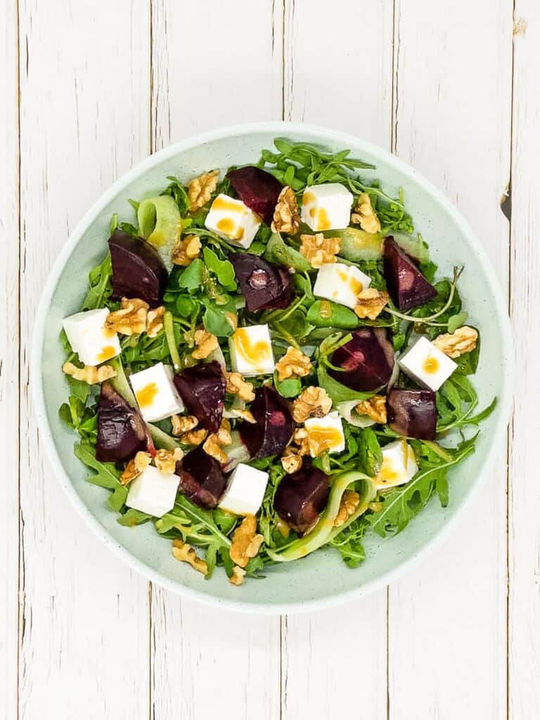 A bowl of feta and roasted beetroot in a bowl.