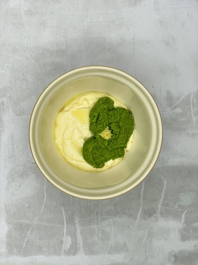Olive oil mixed with mayo, pesto, lemon juice, and garlic.