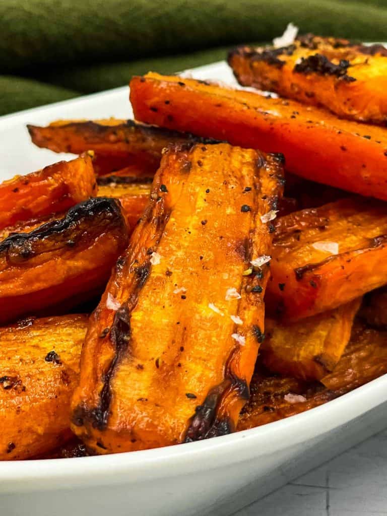 Maple glazed air fryer carrots in a serving dish.