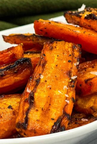 Maple roasted air fryer carrots on a serving dish.