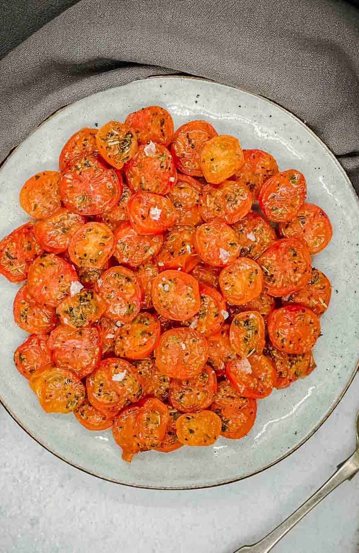 A plate of air fried cherry tomatoes.
